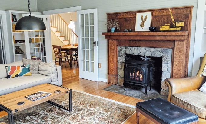 Burnsville House | Creekside Iconic Yellow Farmhouse with firepit