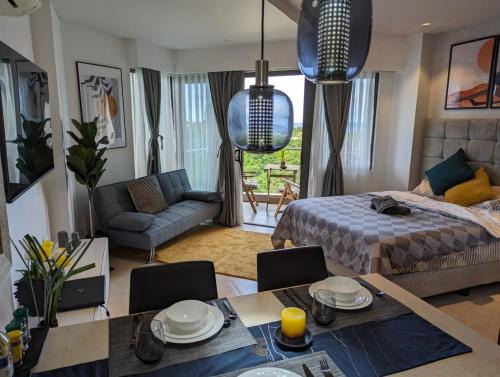 Maribago Apartment | Dominiks Stylish Resort Gem Ocean View Pool Queen Bed at Tambuli 8 Floor Fast Wifi