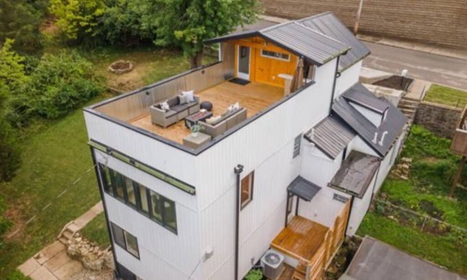 Covington House | Downtown skyline view featuring giant rooftop deck & wet bar with a city view.