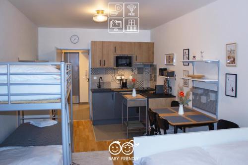 Harrachov Apartment | ENJOYHARRACHOV - Atraktivní slunné studio Čertovka v centru Harrachova s garážovým parkováním, Wifi-WLAN, Ipad, SAT, herní konzolí, Netflix zdarma a nejkrásnějším výhledem na Čertovu horu s areálem skokanských můstků a sjezdovku
