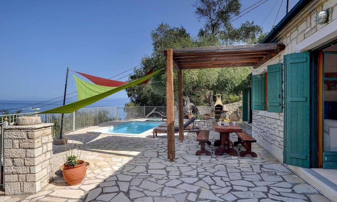 Longos House | From its elevated position directly above Levrecchio beach, this wonderfully light and airy villa en