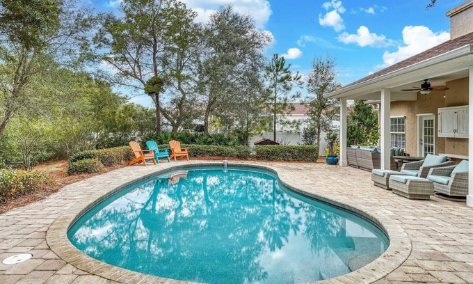 Seacrest House | Giant Backyard Oasis with Heated Private Pool, Fire Pit, and Outdoor Lounge
