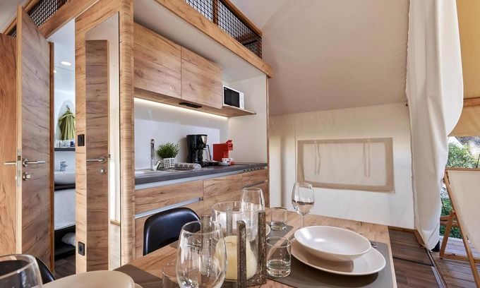 Nunspeet Cabin | Glamping tent equipped with living room, kitchen and bathroom.