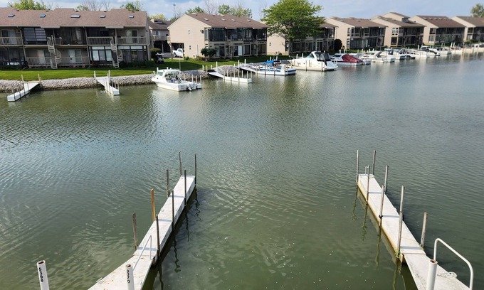 Oak Harbor Condo | Gorgeous waterfront balcony view & boat dock on the shores of Lake Erie