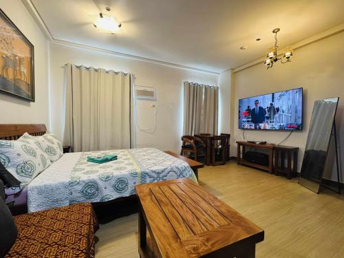 Trece Martires Apartment | Happy Stays E - 300mbps - 65"TV NetFlix, Disney - Washer