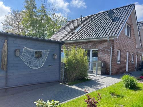 Dornum House | Haus Nordseeliebe mit Außensauna, Outdoor Dusche und Wallbox