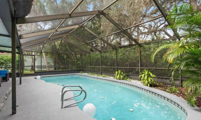 Palm Harbor House | Heated pool. 4-bedroom house. 6.9 miles to honeymoon Beach.