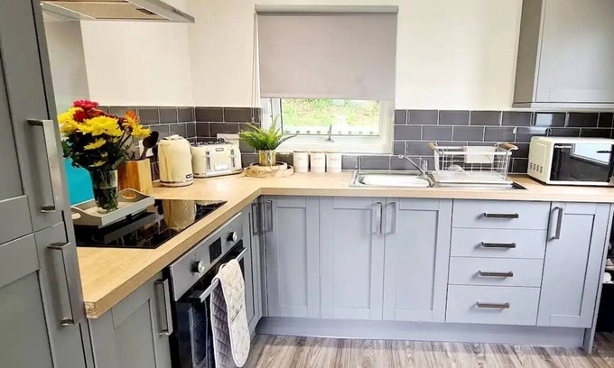 Bont Newydd Ski Chalet | Hillside Hideaway Chalet With Swimming Pool, Play Area, Fishing Lake