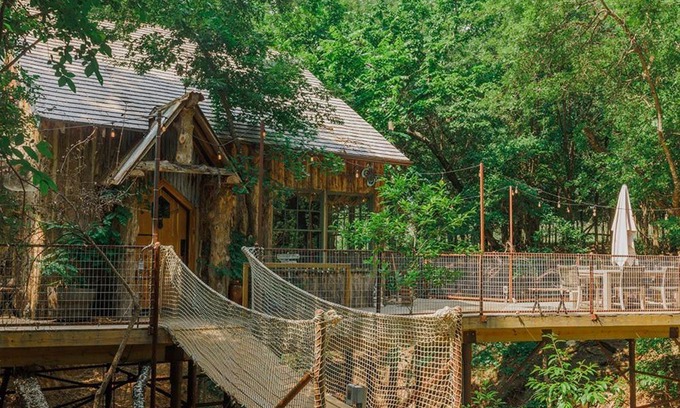 Dennis Ski Chalet | Hobbit Treehouse with waterfall on the Brazos River! 350 acres! Tubing! Petting zoo!