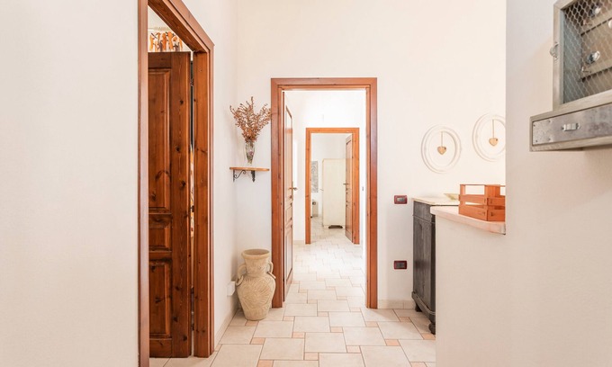 Scano di Montiferro House | Holiday Home 'La Casa Rosa Di Rita E Franco' with Balcony and Wi-Fi
