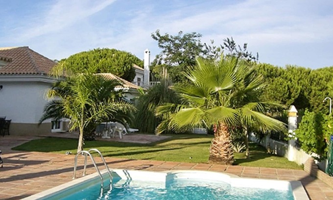 Nuevo Portil Villa | Homerez - Villa 500 m away from the beach for 6 ppl. with shared pool and garden