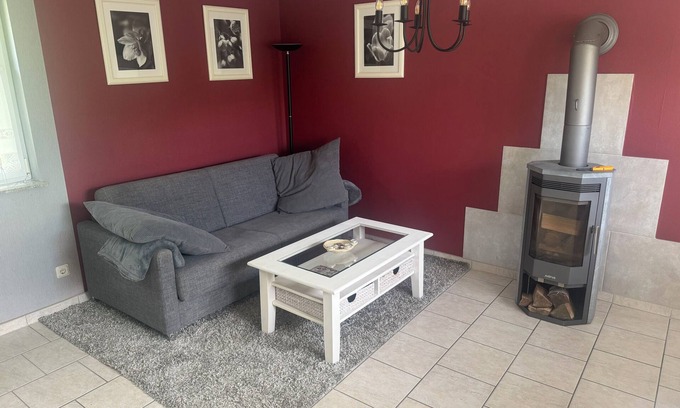 Stuthof House | Idyllic bungalow surrounded by greenery, perfect for relaxing.