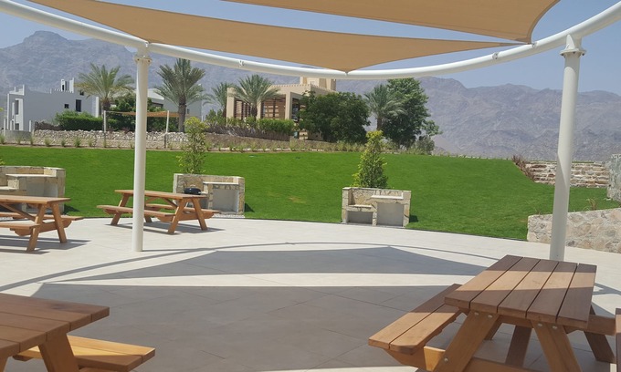 As Sifah Apartment | Idyllic Seaside Residence. Lush Golf & Ocean Views. Superb on site amenities.