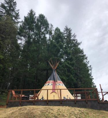 Leland Other | Indulge in the ultimate Glamping experience with our Luxury Tipi packages featuring four unique sites with private decks, indoor and outdoor fire pits, and exclusive access to 155 acres of private hiking trails