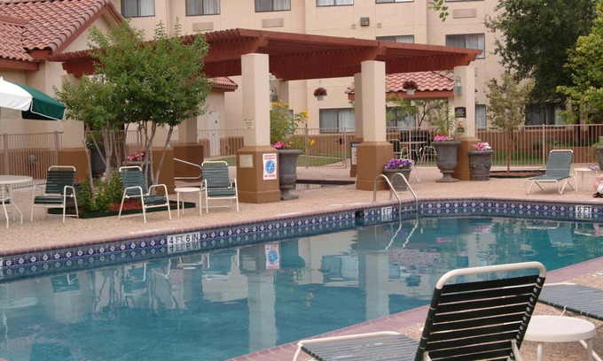 Tech Terrace Condo | King Suite. Shared Pool & Hot Tub. Free Breakfast. Near Texas Tech University & University Medical Center.