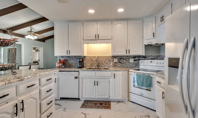 Lakeside City House | Lakefront Guesthouse. Near Sheppard Air Force Base & MSU. Gated, game room & fun