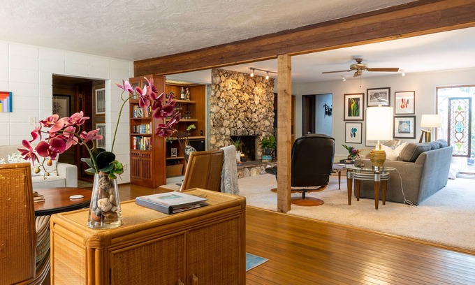 Maitland House | Large living area, tropical backyard with swimming pool & covered back porch