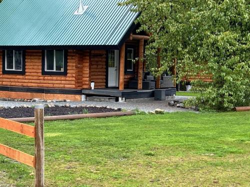 Central Okanagan House | Log lofted rustic cabin in woods