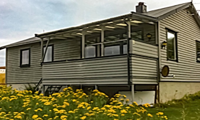 Repvag House | Look forward to a fantastic view of the fjord in this vacation home!