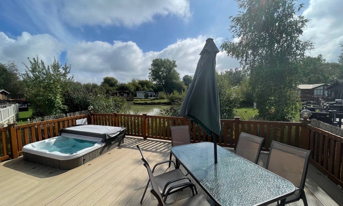 Tattershall Cabin | luxury lakeside lodge with a sunken hot tub on bull rush a peaceful feature lake @Tattershall lakes