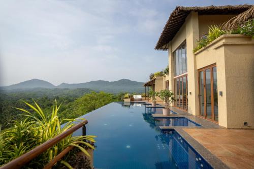 Quepem House | Master Bedroom with Jacuzzi in a Villa hosted by Masaya Stays