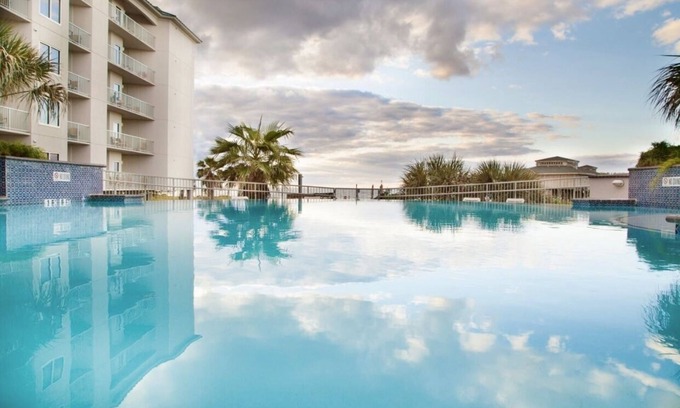 Beachside Village Resort | Memorial Weekend near the seawall with private beach access.