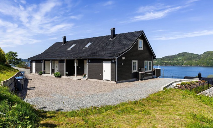 Osteroy House | Modern semi-detached house in natural surroundings with beautiful fjord view.