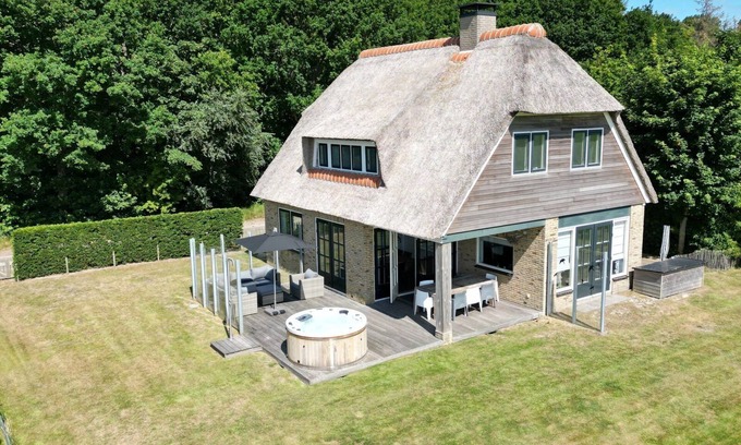 Hollum House | Modern villa with jacuzzi. Village Hollum, forest and beach on walking distance.