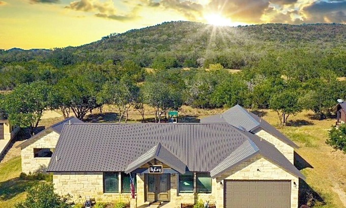 Sabinal House | NOLA styled 6-bedroom home in Concan. Sleeps 36 with AC, WiFi, Pool, Hot Tub