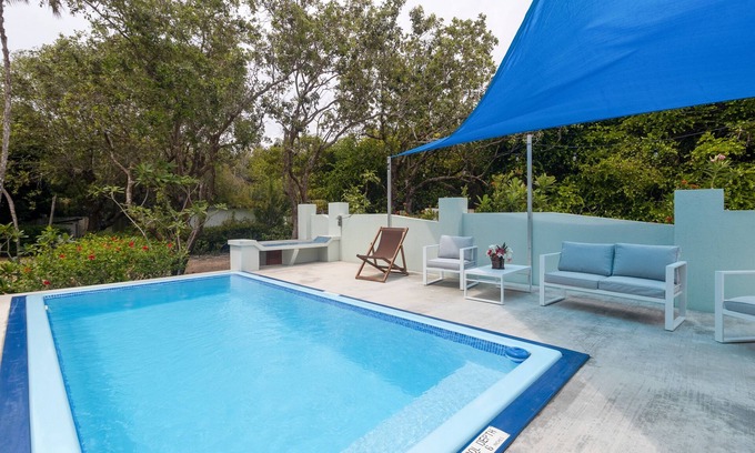 Placencia Apartment | Oceanfront escape with beach access, partial AC, patio, grill, & Ping-Pong