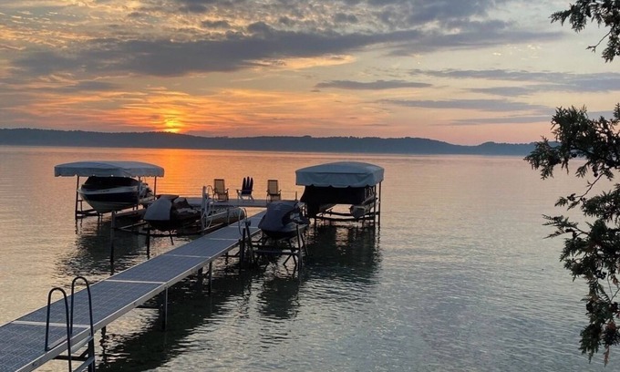 Clam River Cottage | ON TORCH LAKE! Fall Colors are beautiful reflection off of Torch Lake