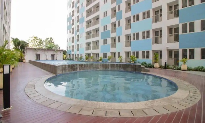 Karawang Hotel | OYO 93386 Apartemen Grand Sentraland by Mira