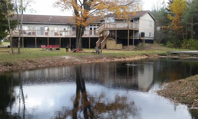 Norton Shores Apartment | Paradise Cove Main 5 Br/2 Baths ~ Sleeps Up To 24 ~ Pond, WIFI, Central AC