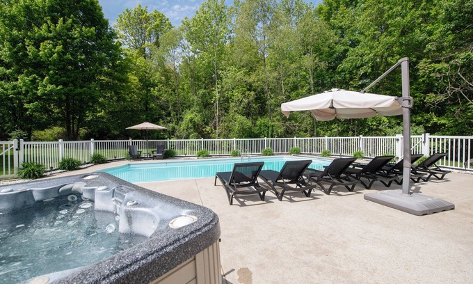 South Haven House | Pool, Hot Tub & Screened Porch w/Fireplace Overlooking Wooded Ravine
