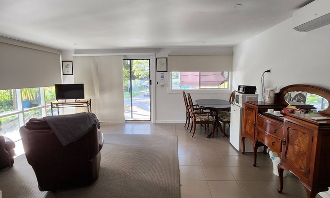 Kyneton Cottage | Pool room - tranquil spacious room with pool views.