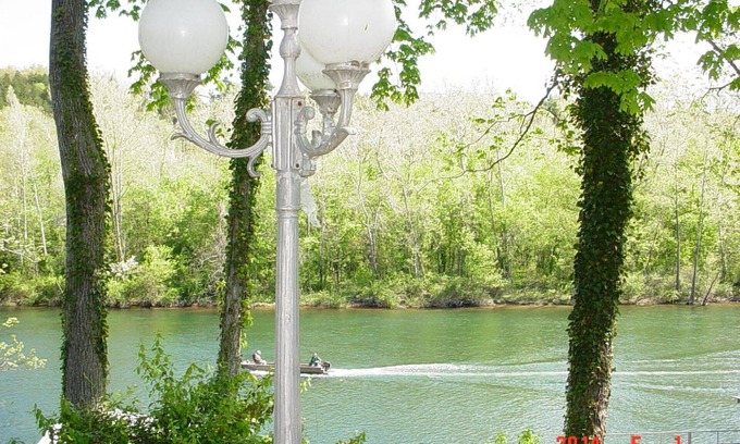 Hollister Apartment | Private suite with a walk-out concrete patio on the lake with access to the dock