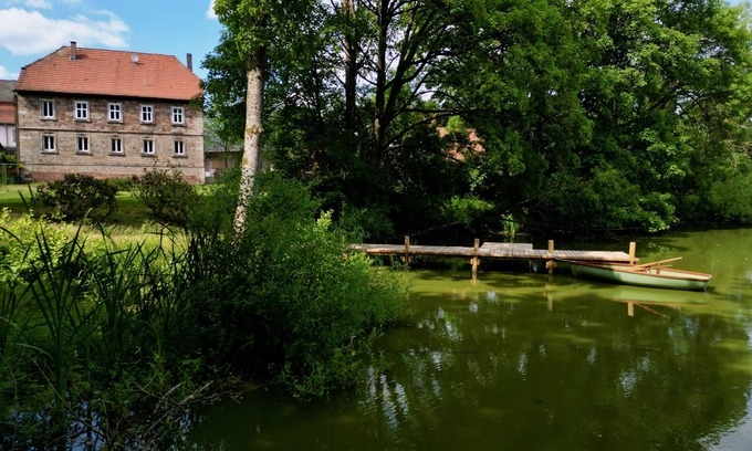 Zeitlofs Condo | Quiet vacation apartment with wood-burning stove, sauna, garden & terrace on historic estate. Castle courtyard