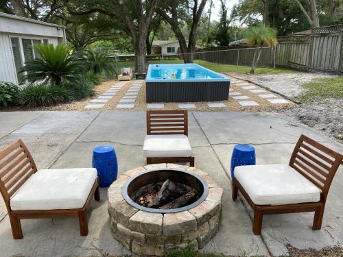 Bearss Plaza House | Reel relaxing across from River in Huge 24 foot Swim Spa