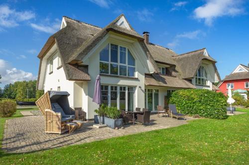 Lobbe Villa | Reethus am Strand - Haushälfte 2 mit Kamin, Sauna
