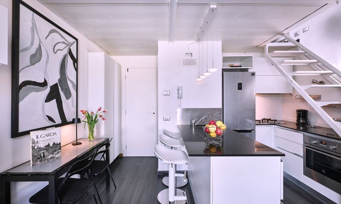 Cisano Apartment | Regarda - modern studio The Beach with lake view near the beach