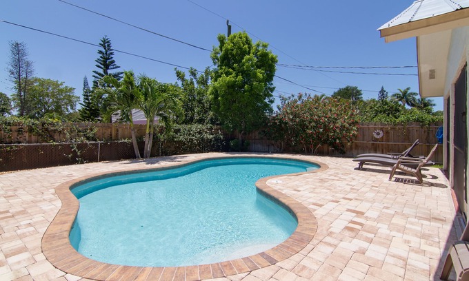 Naples Park House | Relax by the sand at nearby Vanderbilt Beach or hang by heated pool