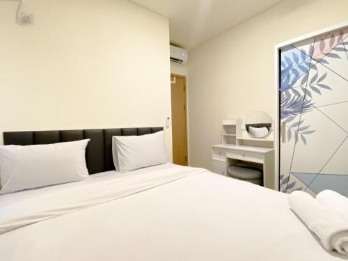 East Jakarta Apartment | Restful and Modern Look 2BR at Meikarta Apartment By Travelio