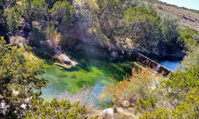 Wimberley House | Romantic hideaway nestled along Lone Man Creek. Views to the falls and hills