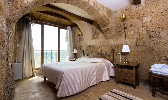 Civita di Bagnoregio Apartment | Romantic home carved into the rock with breathtaking views