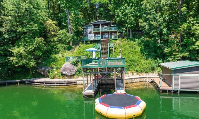 Sunset Cove Cottage | Rustic Cozy Cabin Lakefront Water Trampoline