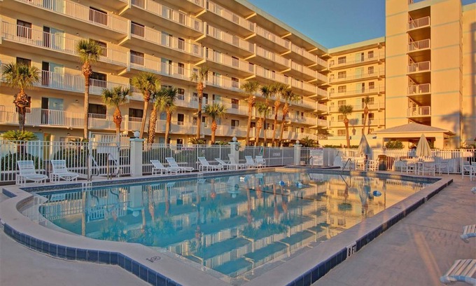 Cocoa Beach Condo | Sandcastles 113 is just steps to the pool and the beach