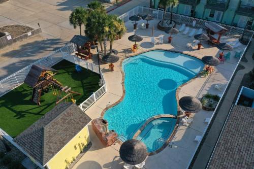 Port Aransas House | Shared Resort-Style Pool Playground Patio w Bar Tidal Times by AvantStay