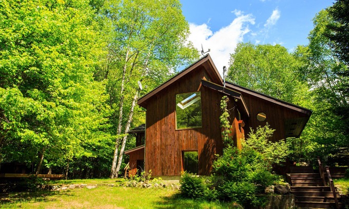 Lac Superieur Village Cabin | Spacious 6 person chalet w/ indoor fireplace, and private hot tub & sauna