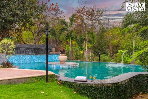 Sohna Villa | StayVista at Maple Farms with Pool, BBQ & Bonfire
