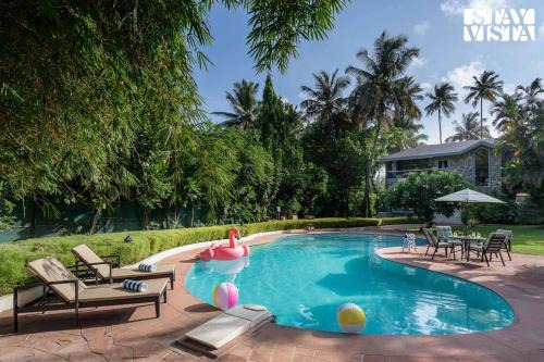 Akshi Villa | StayVista at Waves by the Beach with Beach Access, Pool, Lawn